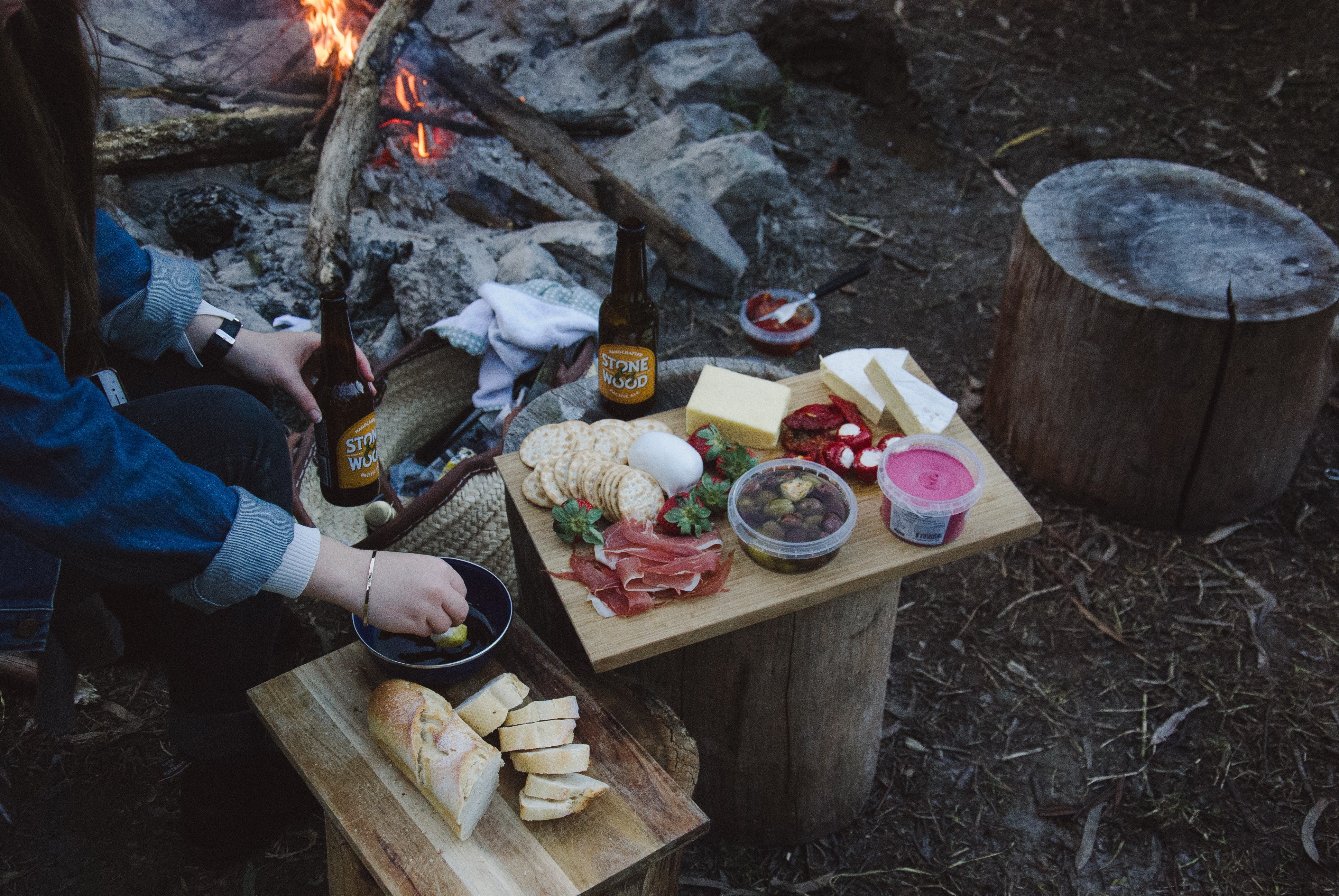 Delicious Camping Food: A Bread and Cheese Platter Next to the Fire